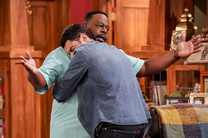 Cedric the Entertainer and Max Greenfield in The Neighborhood